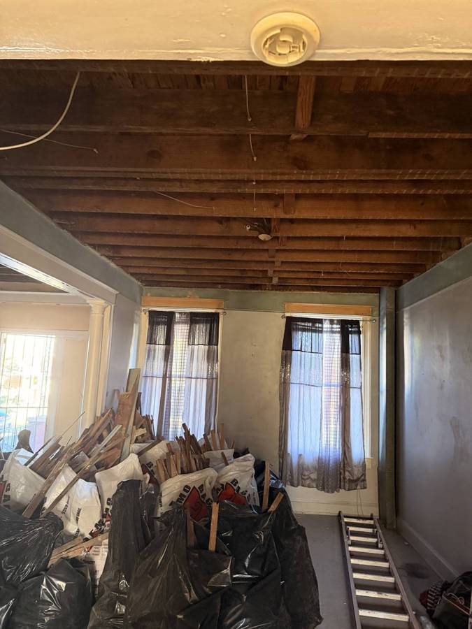 Debris bagged and staged in a front room