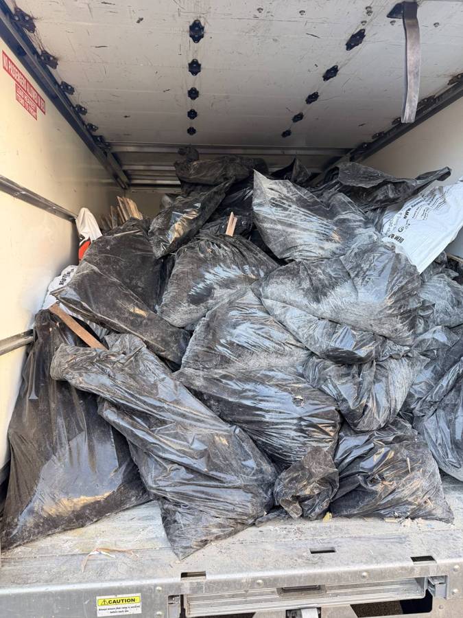 Box truck loaded full of debris bags